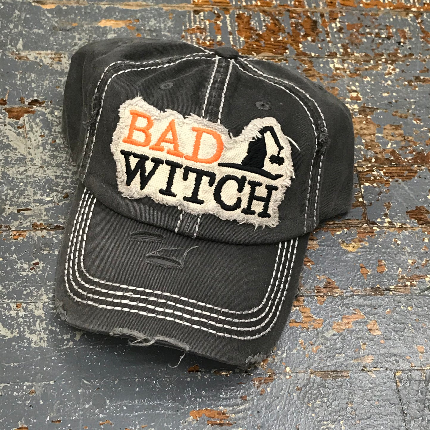 Bad Witch patch baseball cap in a rugged black ball cap.